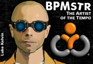 Luke kelvin (BPMstr) in signature goggles with his trademarked logo - wearing orange shirt on black background